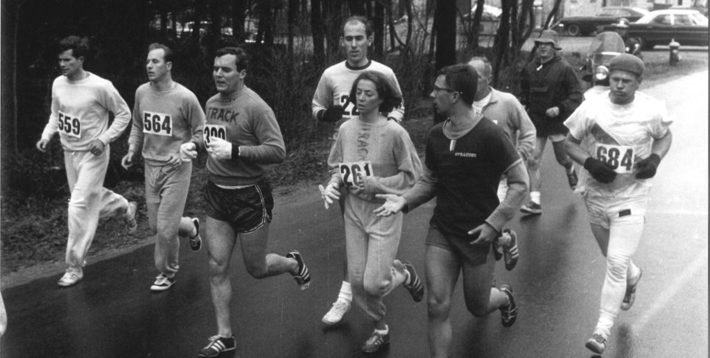 Kathrine Switzer and other runners run