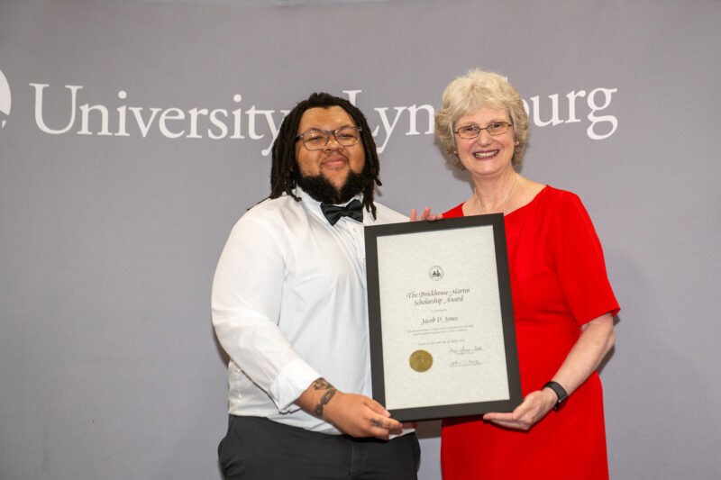 Jacob Jones ’25 (left), winner of the Brickhouse-Martin Scholarship Award and Christopher C. Cowles Award in History poses with Dr. Alison Morrison-Sheltar