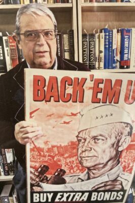 Hugh Scrogham ’66, ’69 MEd with World War II poster