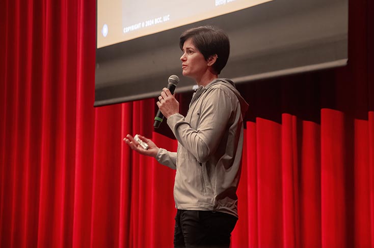 Betsy Butterick, the “Coaches’ Coach,” speaks to employees on RED Day. 