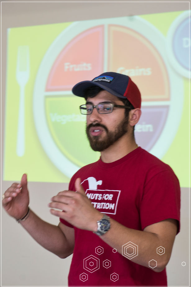 Master of Public Health Jobs - A Master of Public Health educator talks to a room in front of a slide about nutrition