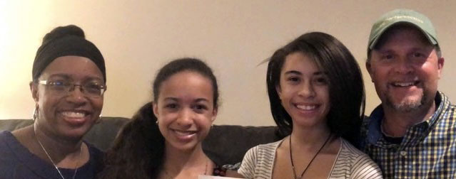 Alea Wood (left) with her two daughters and husband